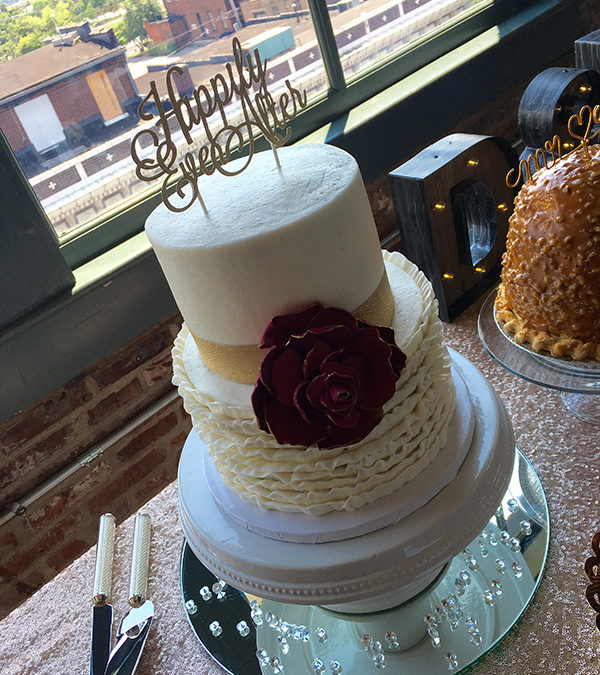 Ivory Ruffle Wedding Cake with Gold Band and Burgundy Flower