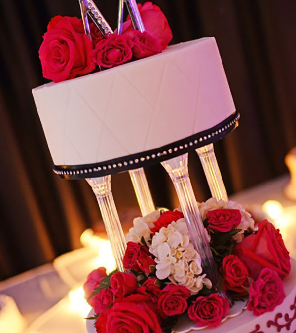 Red Black and White Column Tiered Wedding Cake with Red Roses